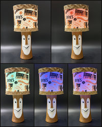 Tiki Bob tiki table lamp, lit, with vintage-inspired print shade