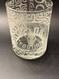 Empty rocks glass with Kapu Creations logo and Tapa wrap, showing an optional logo example.
