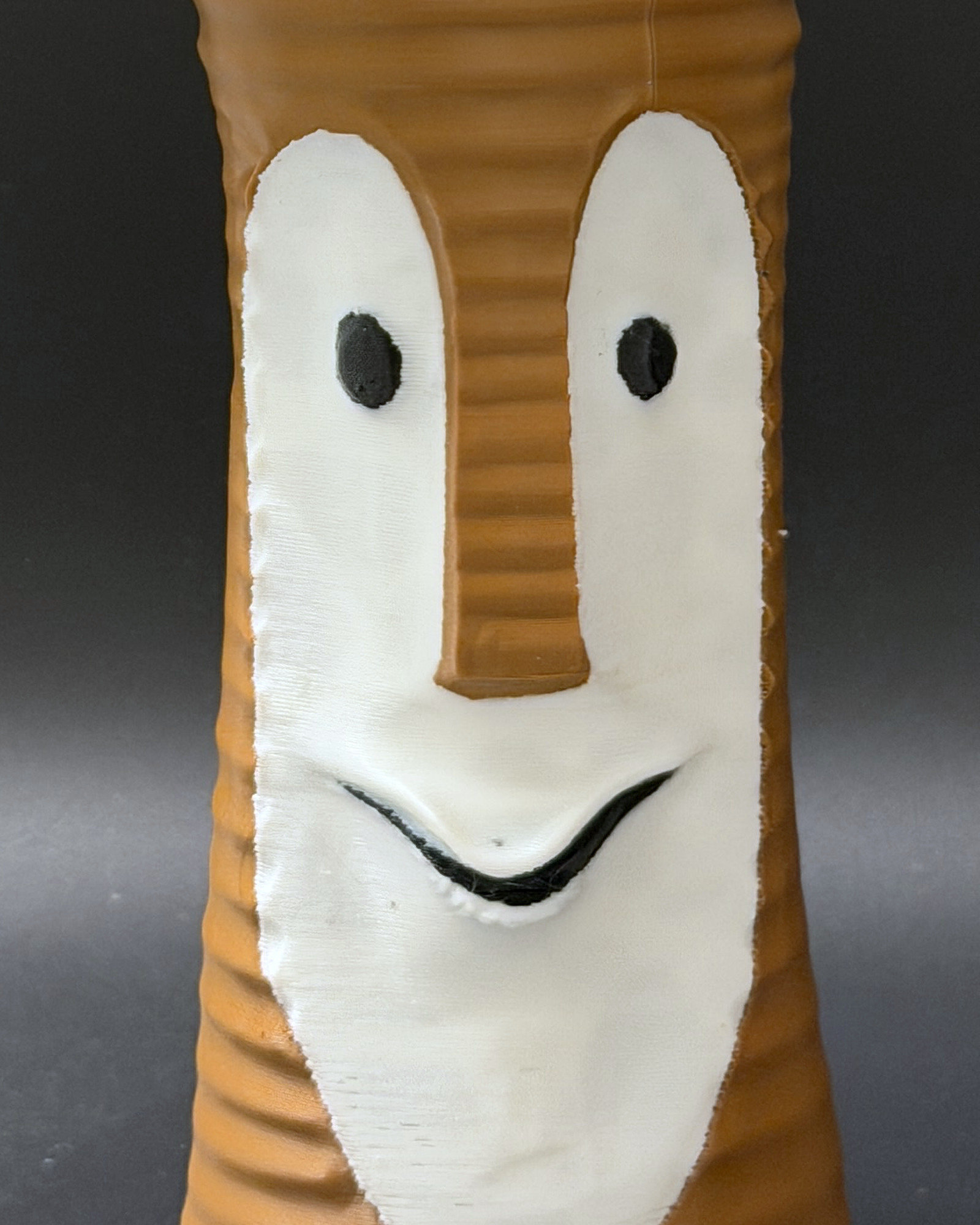 Tiki Bob tiki table lamp, lit, with vintage-inspired print shade