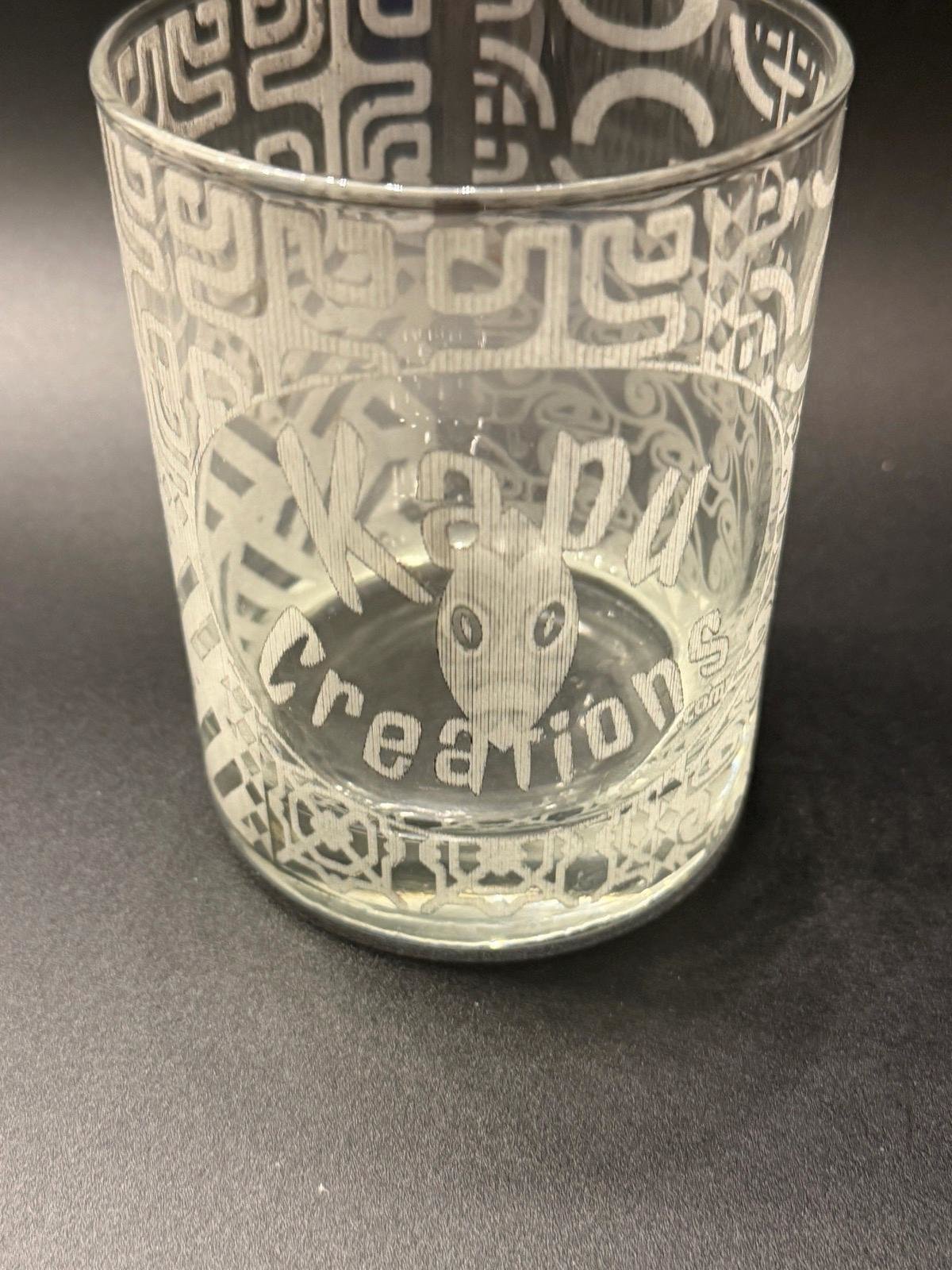 Empty rocks glass with Kapu Creations logo and Tapa wrap, showing an optional logo example.