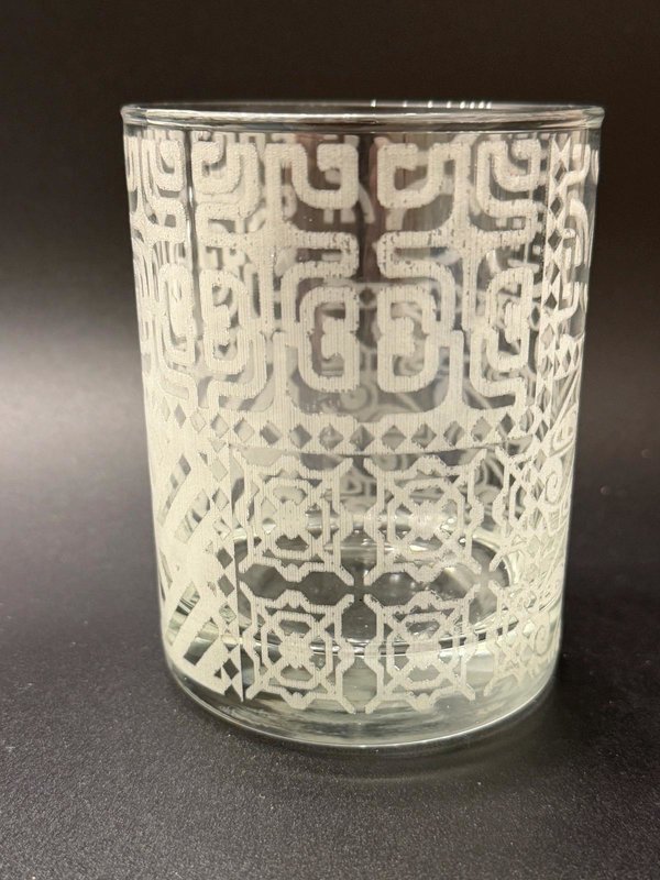 Empty 14 oz rocks glass showing the offered Tapa geometric wrap pattern.